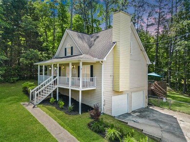 View of front of property with stairs, covered por