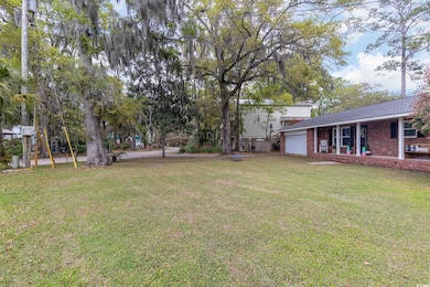 View of yard featuring an attached garage