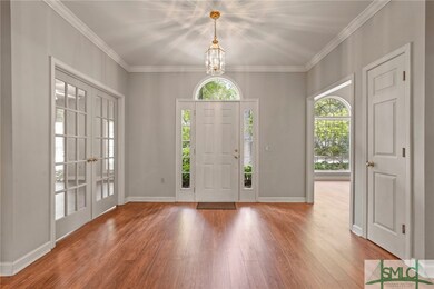 Foyer flanked by 4th BR/Office & Dining Room