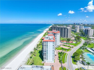 Bird's eye view of apartment complex and unending shoreline