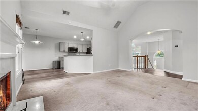 Unfurnished living room with a brick fireplace, ca
