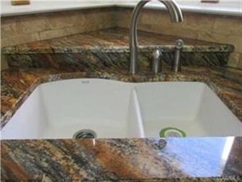 Corner sink with a view of the lake.