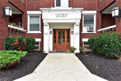 Doorway to property featuring brick siding and cooling unit