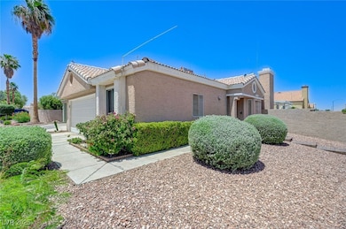 View of side of property featuring a tile roof, a