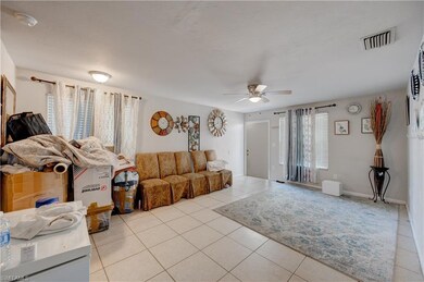 Living area featuring light tile patterned floors,
