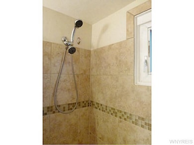 Bathroom. Detail of the tile work and new window i