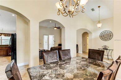 Formal dining room flowing into living and kitchen