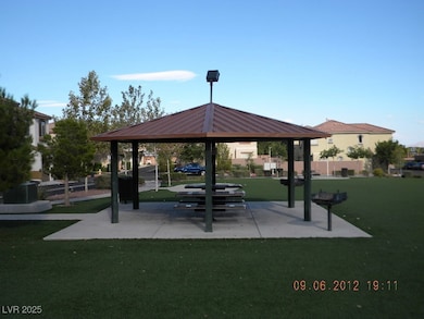 View of home's community with a gazebo and a lawn