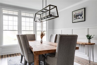 Tons of natural light in the dining room. Custom dining room table made from an old tree right here in RVA. Seats 6-8 people easily.