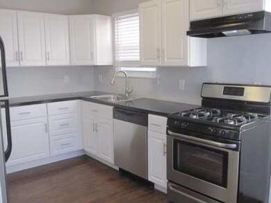 This contemporary kitchen comes with black granite
