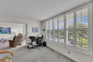 Second bedroom with garden, pool and water views