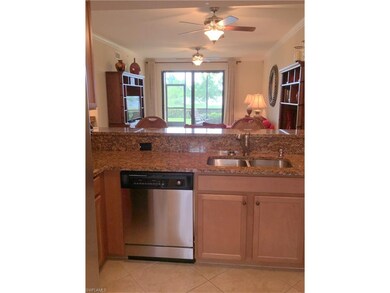 View of living area and rear lanai from kitchen
