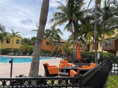 Community pool featuring a patio area and an outdoor hangout area