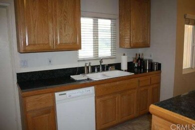 Granite Counter Tops, Sink Area Overlooks Front Ya