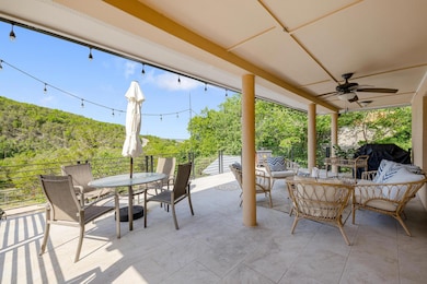 View of patio with outdoor dining space, a ceilin
