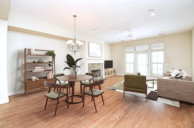 This spacious living area features hardwood floors