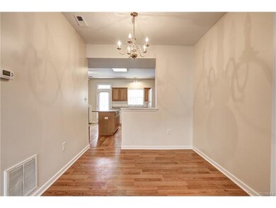 Dining room is separated from kitchen by a half wa