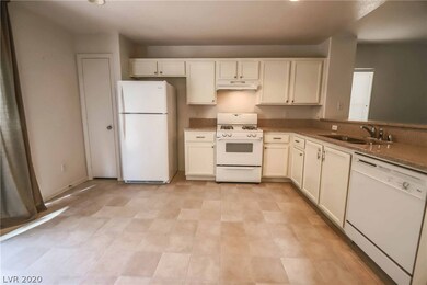 Kitchen with white appliances, refrigerator includ