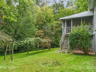 Screened in porch leads  to the expansive backyard