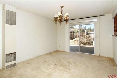 Formal dining room.  Gas wall heater is in additio