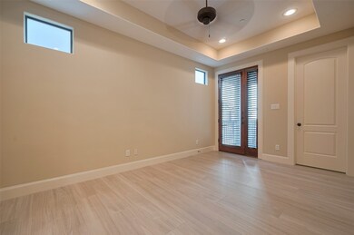 Downstairs Bedroom/Office leads  to an outdoor pat