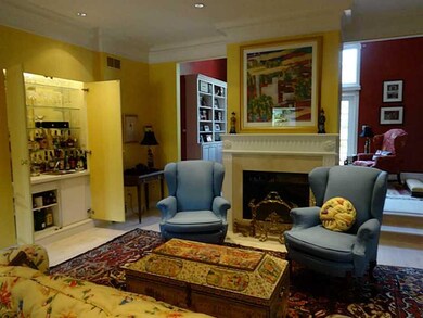 Living Room. wet bar-doorways lead to den