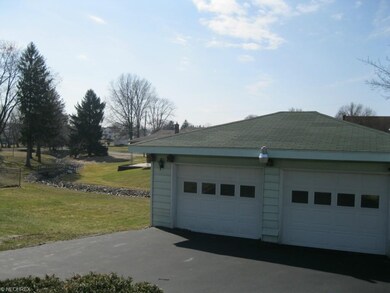2 car garage, extra parking. The stone lined creek