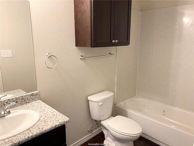Bathroom with vanity and tub / shower combination