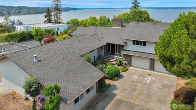 Home has a very long driveway in addition to a roundabout driveway