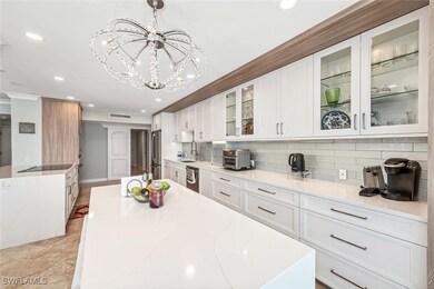 Kitchen with a sink, decorative backsplash, appliances with stainless steel finishes, visible vents, and recessed lighting