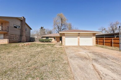View of front facade with a garage, a front yard, 