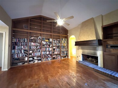 Unfurnished room featuring ceiling fan, built in f