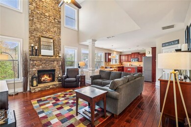 Living room featuring a fireplace, plenty of natur