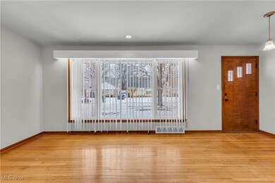 Entrance foyer with light wood-type flooring