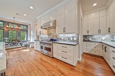 KITCHEN/BUTLER'S PANTRY AREA  Cabinets to the ceiling! A place for everything.  Wonderful prep and serving areas.  Resilient Vermont Stone.