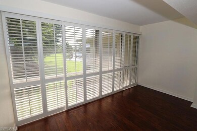 Spare room with dark hardwood / wood-style floorin