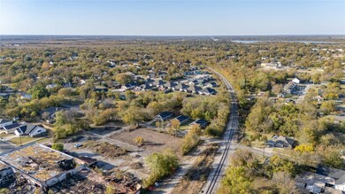 Aerial overview of property's location with nearby suburban area