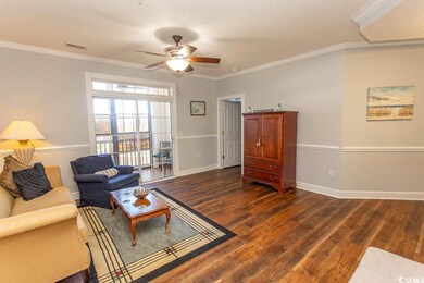 Living room featuring a textured ceiling, dark woo