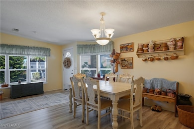 Dining room featuring a chandelier, plenty of natu