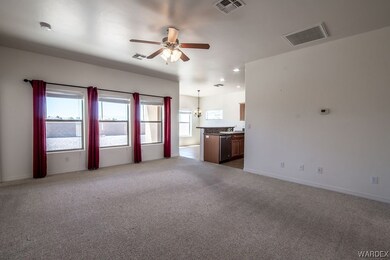 Living room featuring natural light, carpet, and a