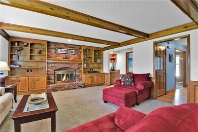 Spacious family room with lots of wood accents.