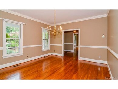 Dining Area with chair rail accent and crown moldi