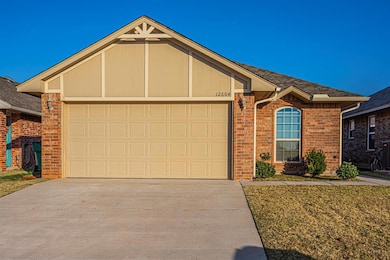 View of front of property featuring brick siding, concrete driveway, an attached garage, and roof with shingles