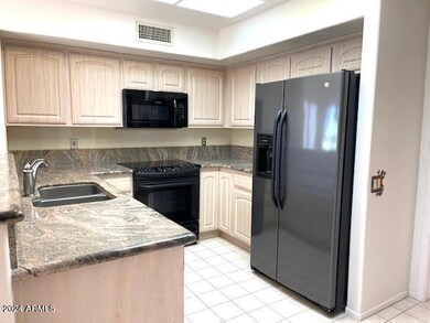 Newer Appliances and Refaced Cabinets.