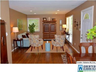 Great room with hardwood floors and recessed light