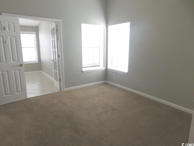 Unfurnished room with light colored carpet, basebo