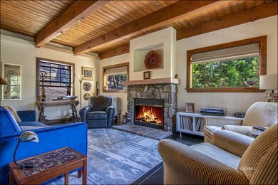 Stone fireplace with picture windows