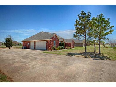 Exterior Front. Oversized driveway and 3 car garag