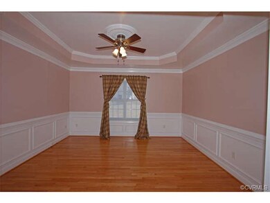 The formal dining room has beautiful mouldings; pi