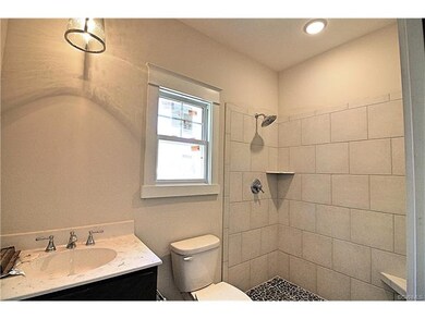 Gorgeous guest bathroom with tile drain pan and ma